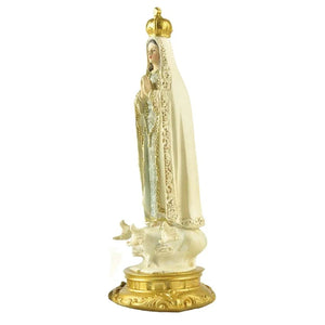 Vue latérale de la figurine religieuse en résine peinte à la main
