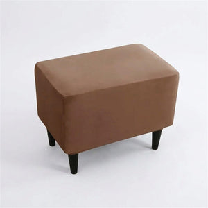 Housse de repose-pieds couleur Marron posée sur un pouf