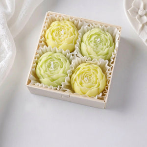 Coffret de quatre bougies parfumées en forme de rose verte