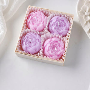 Coffret de quatre bougies parfumées en forme de rose violette