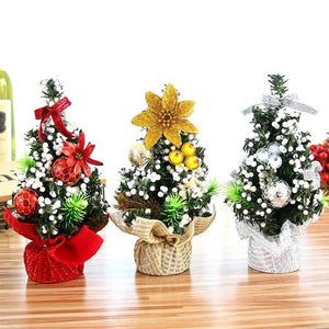 Mini sapin de Noël 20cm disponible en 3 coloris rouge doré argenté sur table en bois