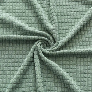 Détail de la texture gaufrée du tissu extensible