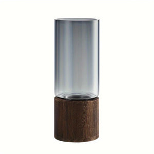 Vase cylindrique en verre fumé avec base en bois sur fond blanc studio