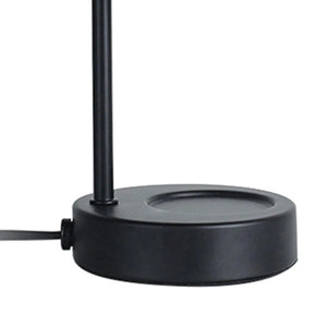 Détail de la base ronde en métal noir de la lampe chauffe-bougie