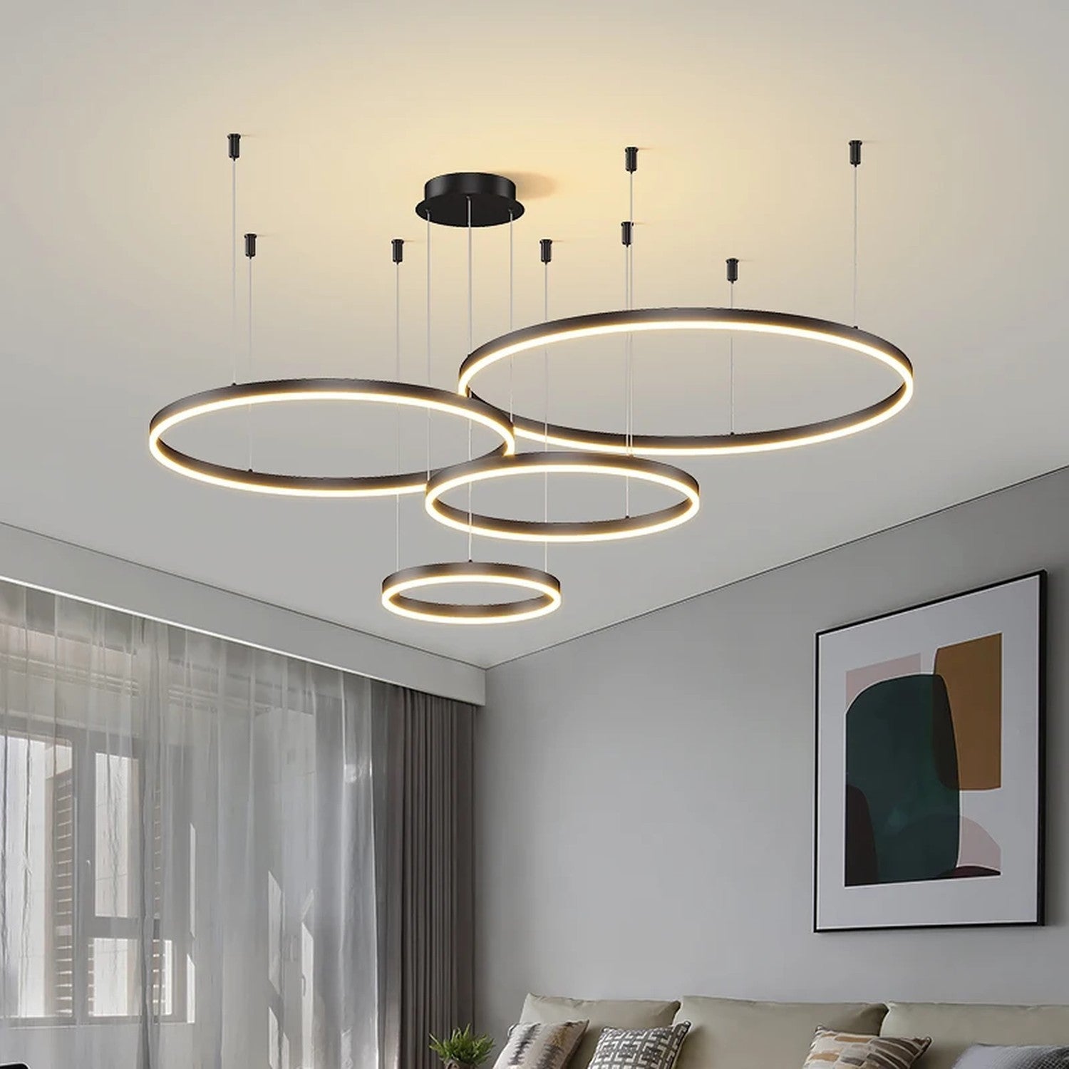 Lustre LED noir design avec plusieurs anneaux lumineux superposés