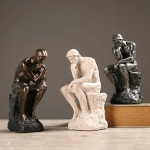 Les trois coloris de la statue de penseur en résine côte à côte beige doré et argenté