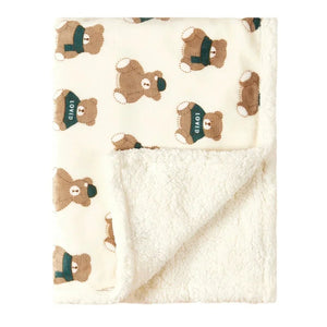 Couverture bébé motif ours au col vert pliée avec doublure peluche