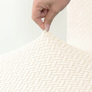 Gros plan sur la texture jacquard extensible de la housse de chaise
