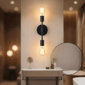 Applique murale noire installée au-dessus d'un meuble vasque avec miroir rond