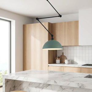 Lampe suspension design nordique verte au-dessus îlot cuisine moderne