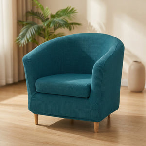 Housse de fauteuil club en jacquard bleu canard sur un fauteuil arrondi