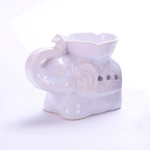 Brûle-parfum céramique éléphant blanc vu de face sur fond neutre