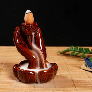 Brûleur encens refoulement céramique marron main de Bouddha