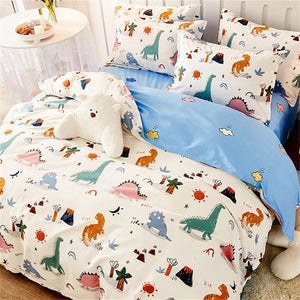 Housse de couette dinosaure multicolore fond crème avec revers bleu et taies assorties