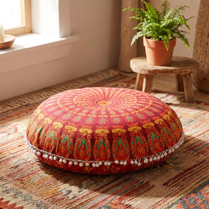 Coussin de sol rond motif mandala rouge et orange avec pompons