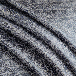 Détail de la texture jacquard extensible pour canapé