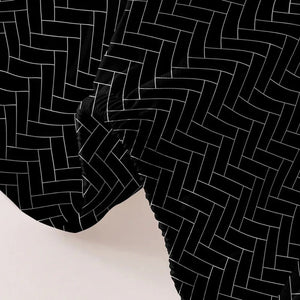Gros plan sur la texture et le motif chevrons du drap housse