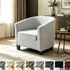 Fauteuil club gris clair à motif feuilles jacquard dans un salon avec les huit coloris disponibles