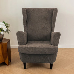 Fauteuil bergère gris foncé vu de face avec housse jacquard complète