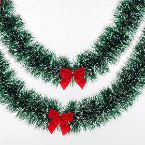 Guirlande de Noël verte avec nœuds rouges
