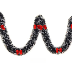 Guirlande de Noël verte drapée en vagues avec nœuds rouges aux points bas