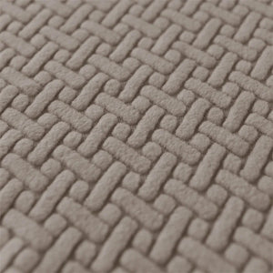 Détail du motif tressé du tissu jacquard de la housse d'accoudoir