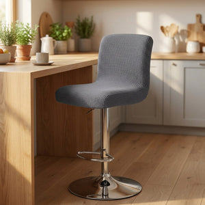 Housse de chaise de bar en jacquard texturé coloris gris sur un tabouret