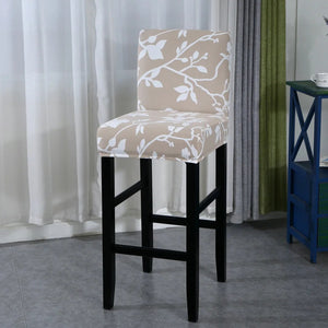 Housse de chaise de bar motif rameaux blancs beige vue du tissu extensible