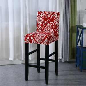 Housse de chaise de bar motif damassé rouge vue du tissu extensible