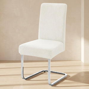 Housse de chaise extensible en maille jacquard Blanc sur une chaise de salle à manger