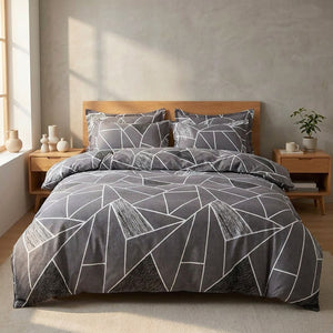 Housse de couette motif géométrique gris dans une chambre épurée au mur béton