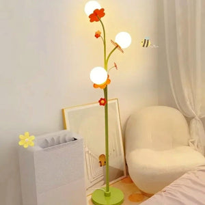 Lampadaire floral 3 globes tige verte fleurs oranges décoration salon