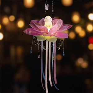 Lanterne lotus violette avec figurine lapin illuminée