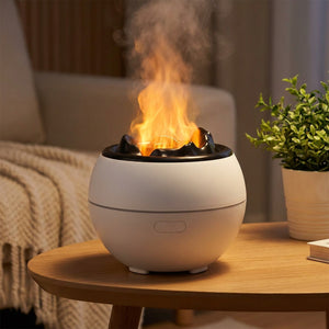 Diffuseur d'huile essentielle blanc a effet flamme sur une table basse avec plante
