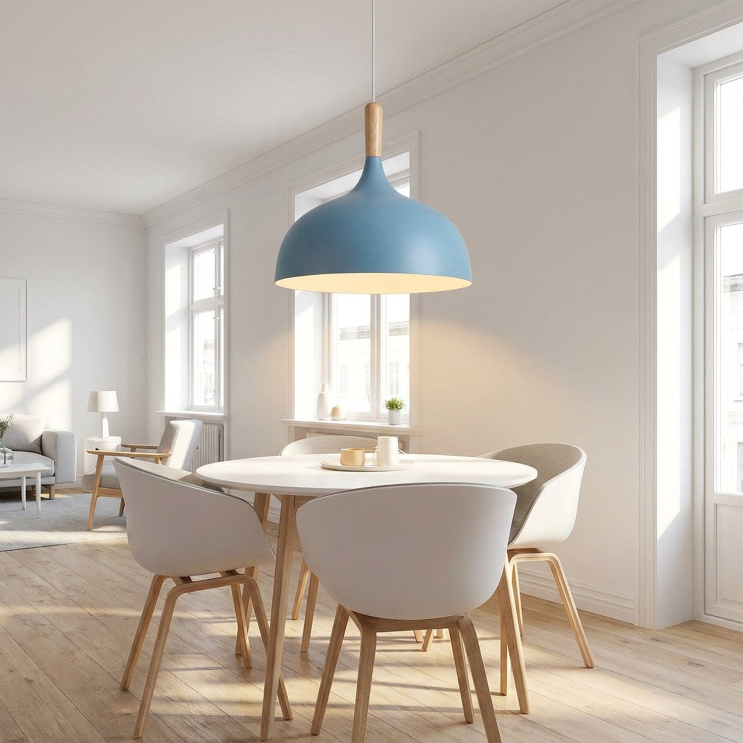 Suspension nordique allumée au-dessus d'une table dans une salle à manger scandinave