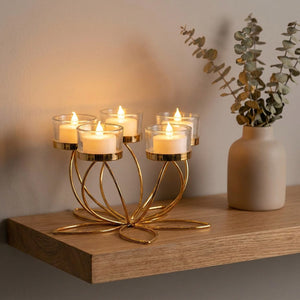Bougeoir lotus doré 5 bras sur étagère avec eucalyptus séché