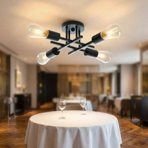 Lustre Sputnik 4 bras au-dessus d'une table dans une salle à manger élégante