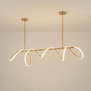 Lustre LED barre linéaire finition dorée fond beige neutre