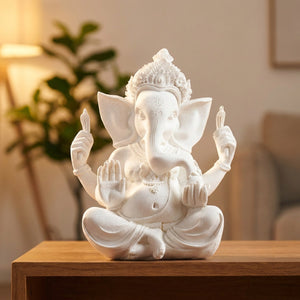 Statue de Ganesh dieu éléphant hindou en grès blanc assise sur un meuble en bois