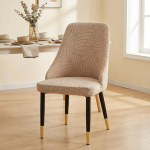 Housse de chaise extensible en jacquard beige au motif feuilles sur une chaise incurvée de salle à manger