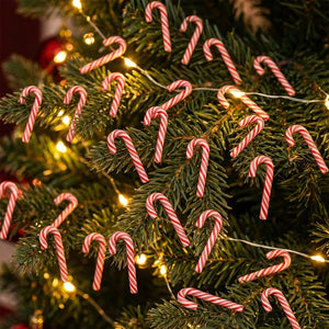 Lot de mini cannes à sucre décoratives en résine rouge et blanc sur un sapin de Noël