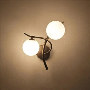Applique murale noire boules de verre orientation gauche