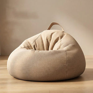 Pouf poire coloris beige sur fond neutre chaleureux