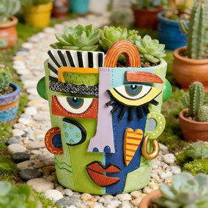 Pot de fleur visage abstrait cubiste en résine verte vue 0