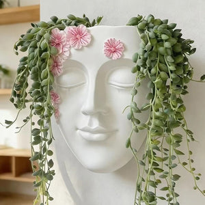 Pot de fleurs mural visage en résine - idées de plantes