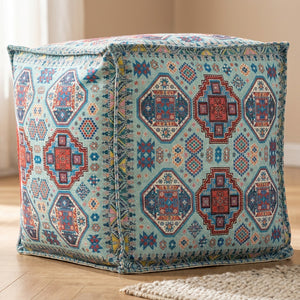 Pouf marocain housse turquoise à motifs aztèques vu de trois quarts