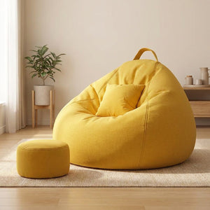 Gros plan sur la texture en lin du pouf géant fauteuil poire jaune avec son coussin assorti