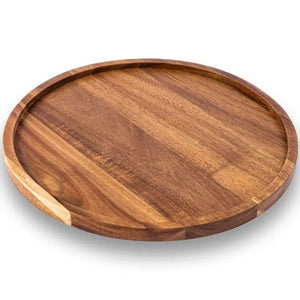 Plateau rond en bois d'acacia vu de trois quarts montrant le grain naturel