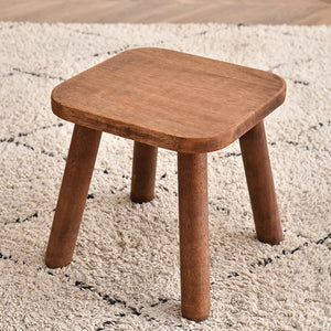 Tabouret carré en bois massif noyer avec assise arrondie et pieds fuselés