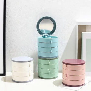 Les quatre coloris de la boîte à bijoux rotative empilés en colonne